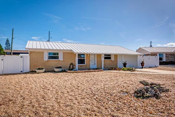 a front view of a house with a patio