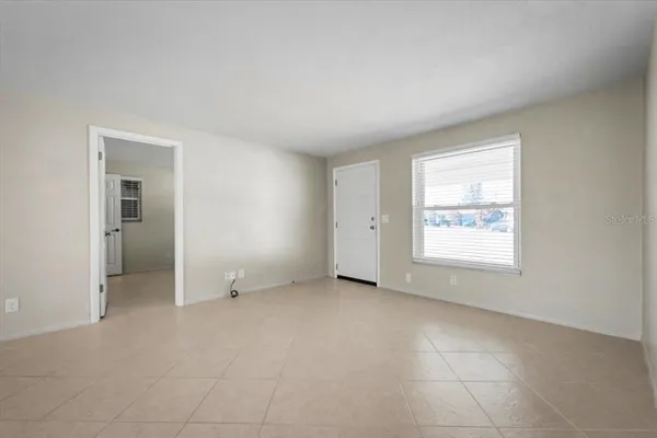 a large kitchen with a lot of counter space and stainless steel appliances