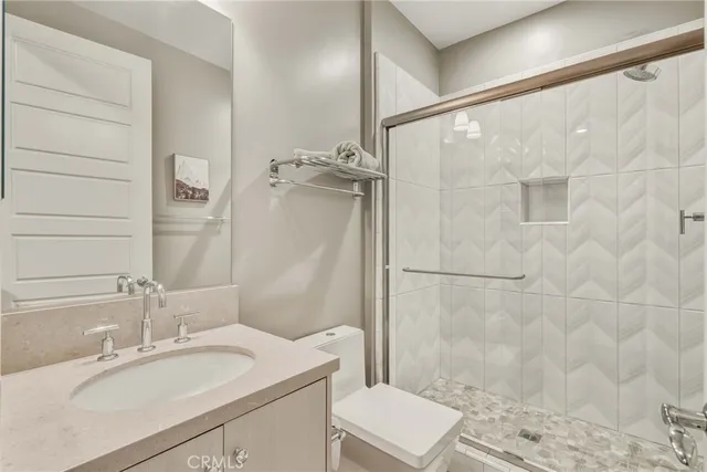 a bed room with a bed and a chair