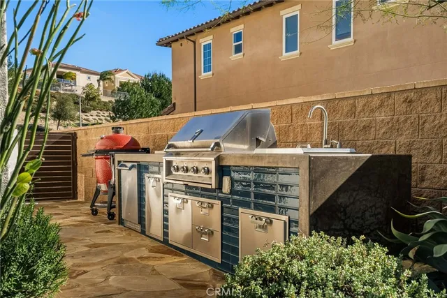 a view of house with swimming pool outdoor seating
