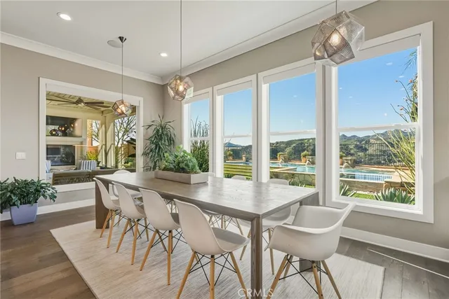a kitchen with granite countertop a white table and chairs