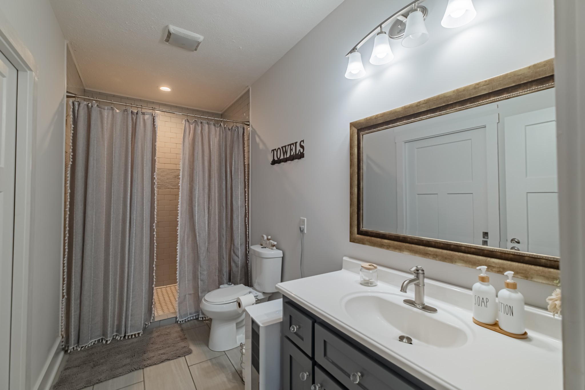 362 Lakeview Street Manchester, TN 37355 - Photo 14 of 39 a bathroom with a sink a toilet and shower