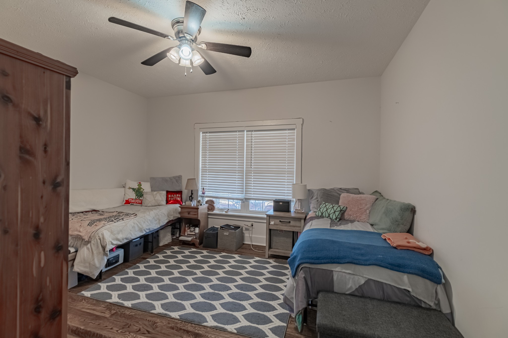 362 Lakeview Street Manchester, TN 37355 - Photo 17 of 39 a bedroom with a bed and a chandelier