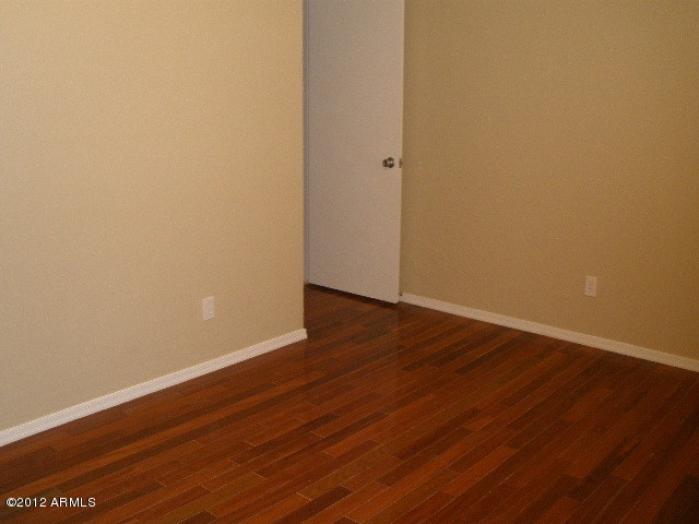 2301 East Greenway Road Phoenix, AZ 85022 - Photo 15 of 22 Front Bedroom with hardwood Flooring