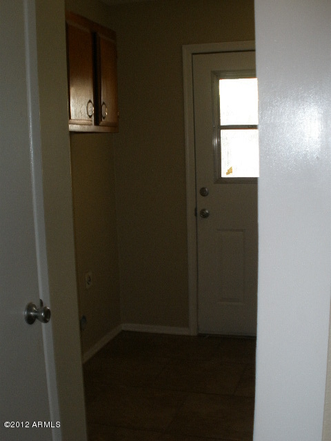 2301 East Greenway Road Phoenix, AZ 85022 - Photo 17 of 22 Utility Room with door to pool