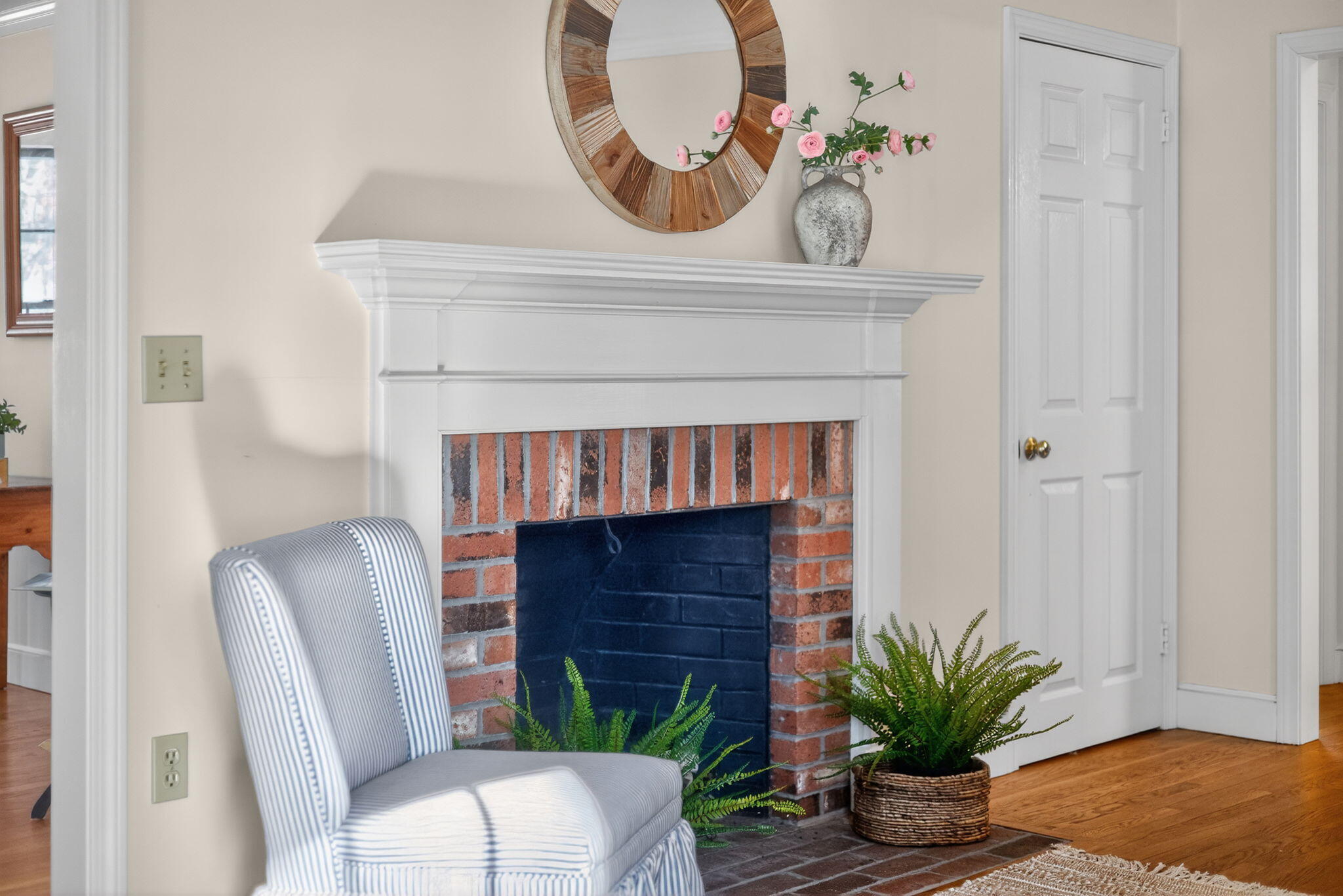 54 Marthas Lane Harwich, MA 02645 - Photo 11 of 53 a living room with a fireplace and a potted plant