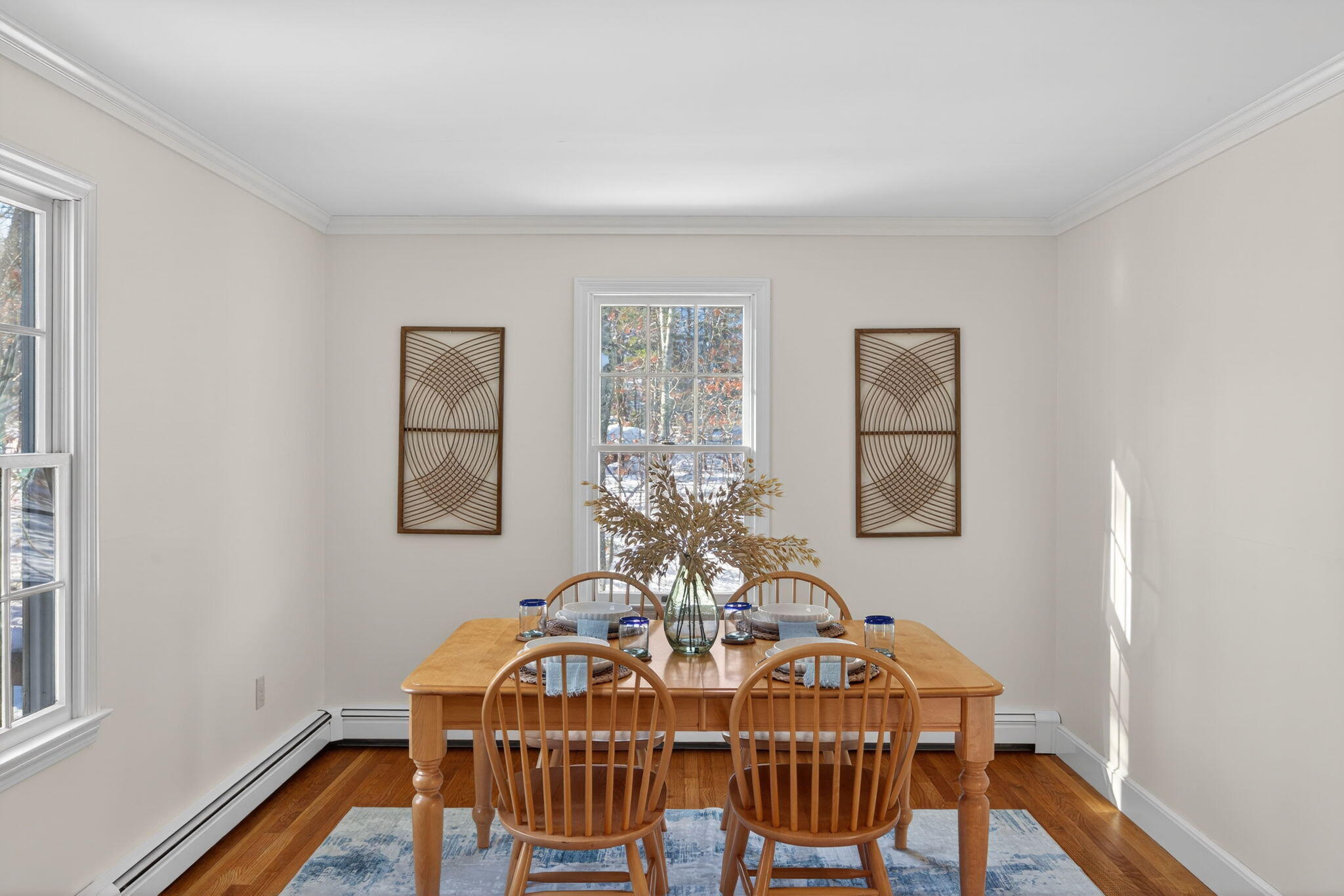 54 Marthas Lane Harwich, MA 02645 - Photo 13 of 53 a view of a dining room with furniture window and wooden floor