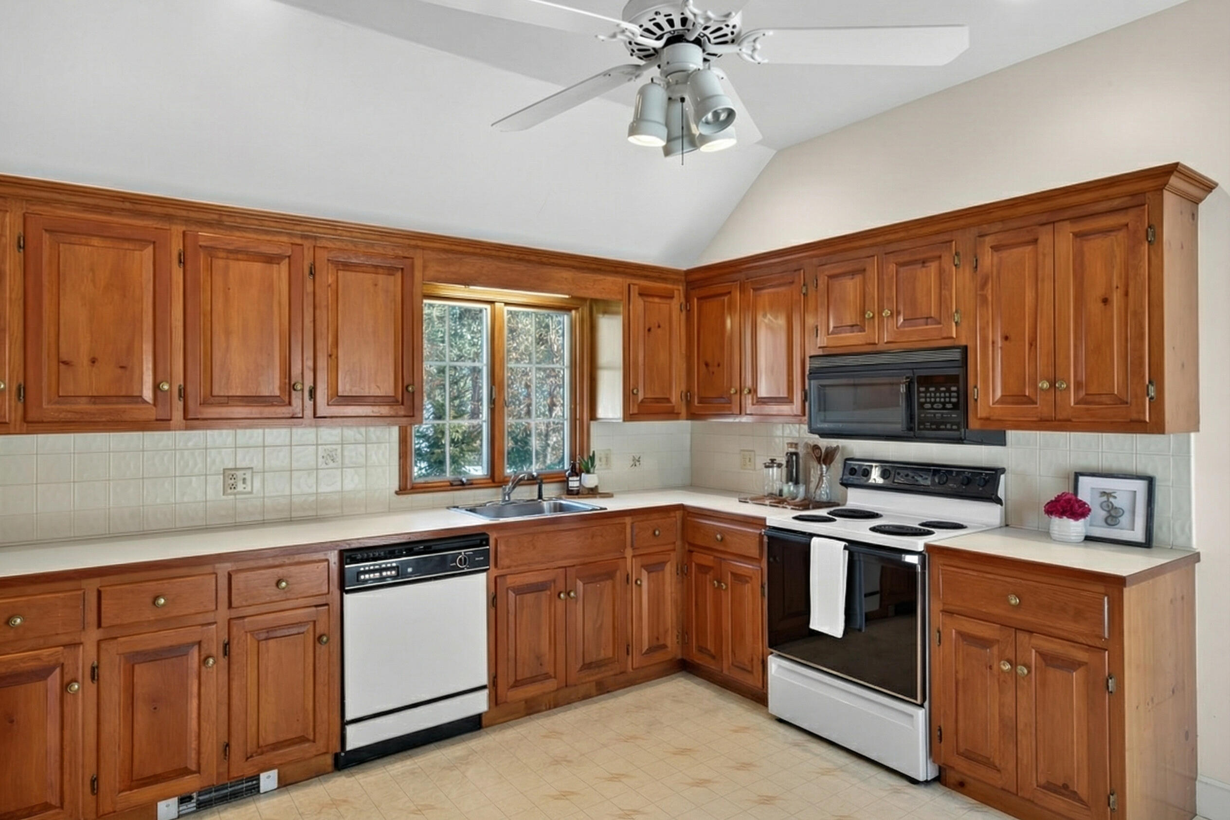 54 Marthas Lane Harwich, MA 02645 - Photo 19 of 53 a kitchen with stainless steel appliances granite countertop a sink dishwasher stove top oven and cabinets with wooden floor