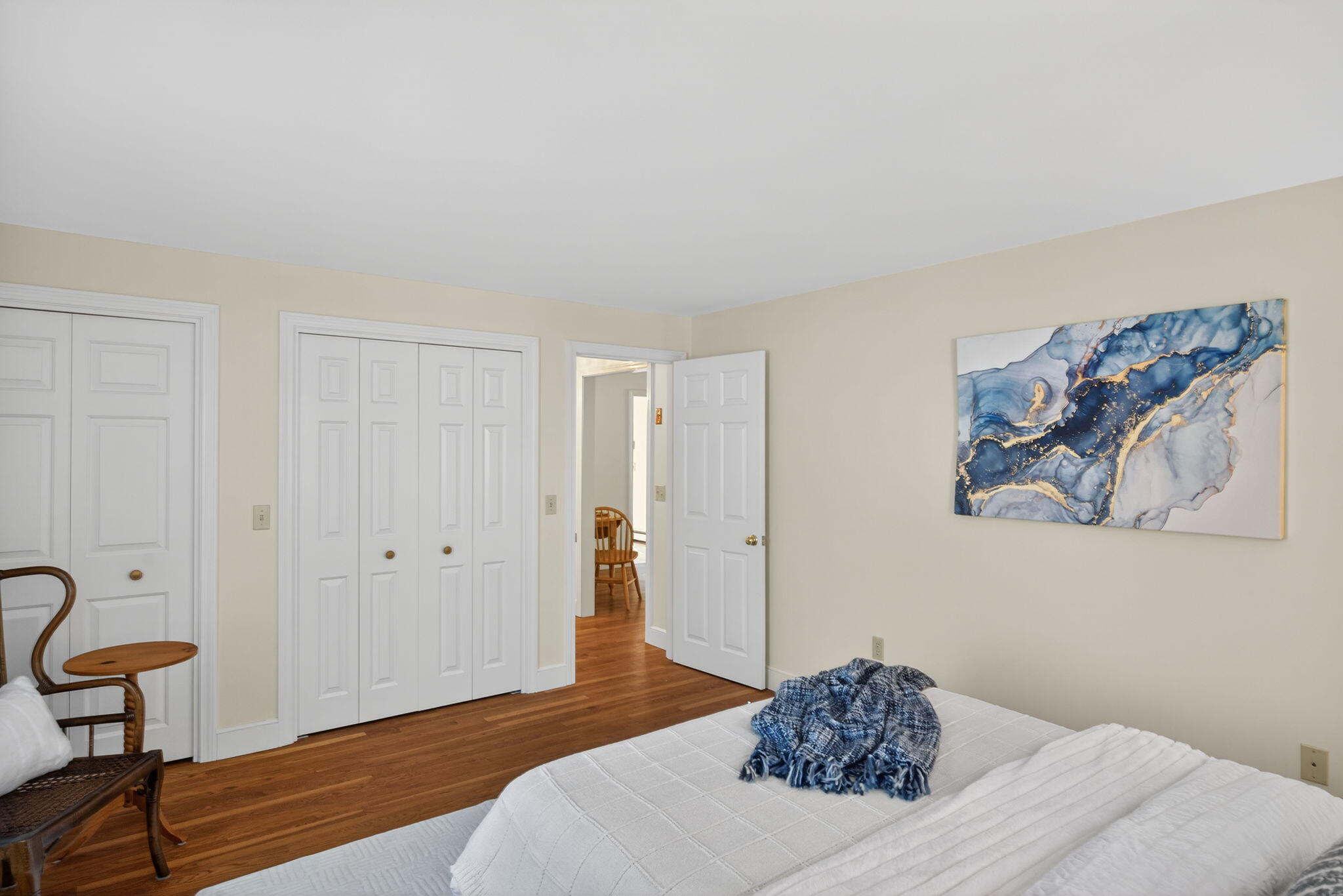 54 Marthas Lane Harwich, MA 02645 - Photo 25 of 53 a bedroom with a bed and a painting on the wall