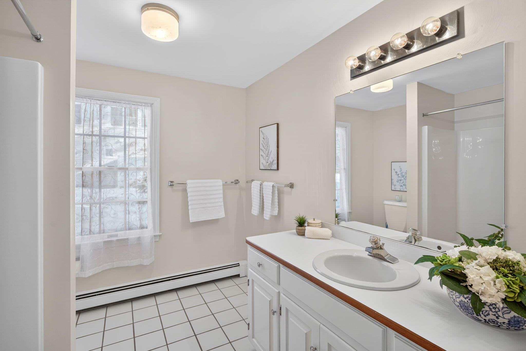 54 Marthas Lane Harwich, MA 02645 - Photo 27 of 53 a bathroom with a sink and a mirror
