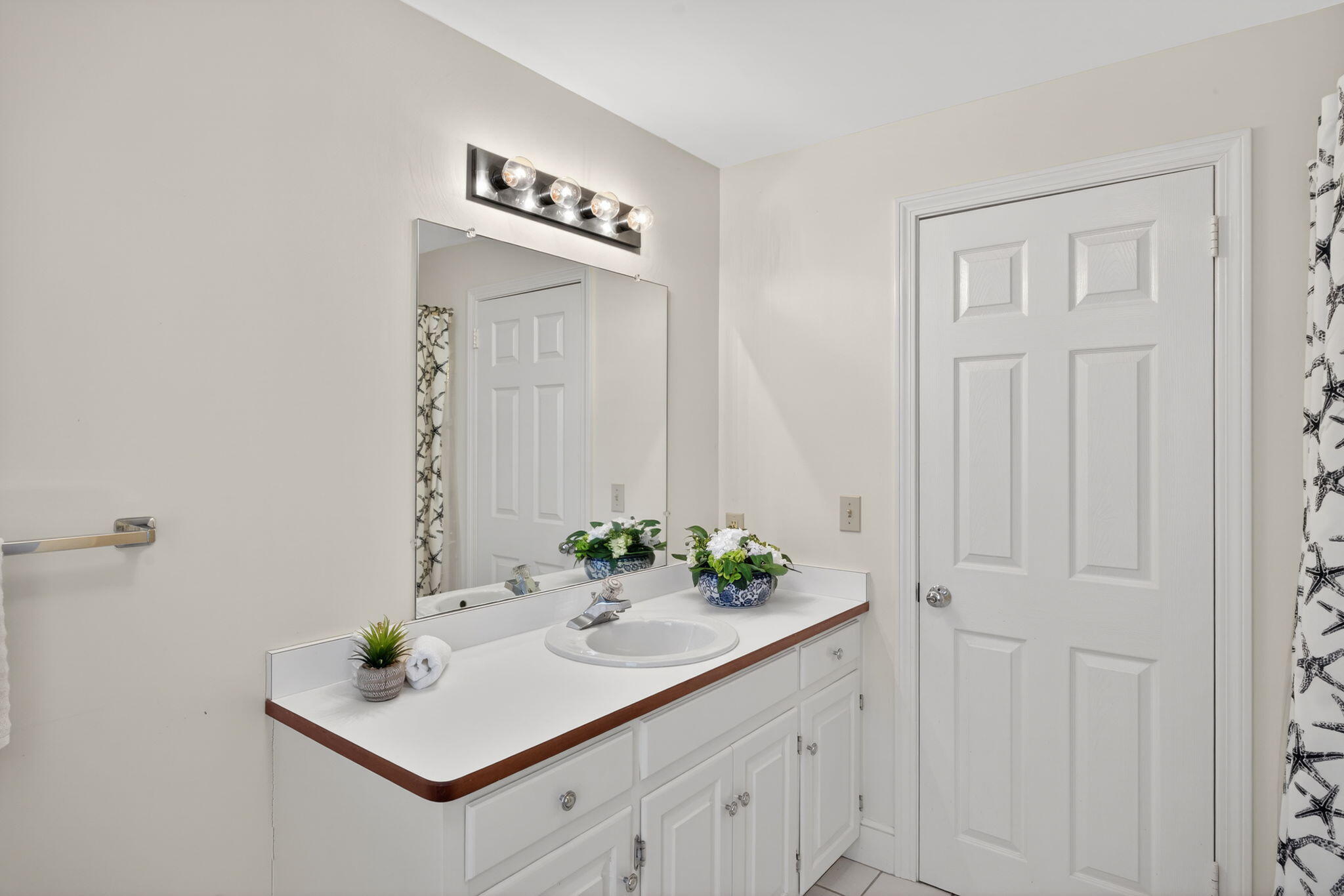 54 Marthas Lane Harwich, MA 02645 - Photo 28 of 53 a bathroom with a sink and a mirror