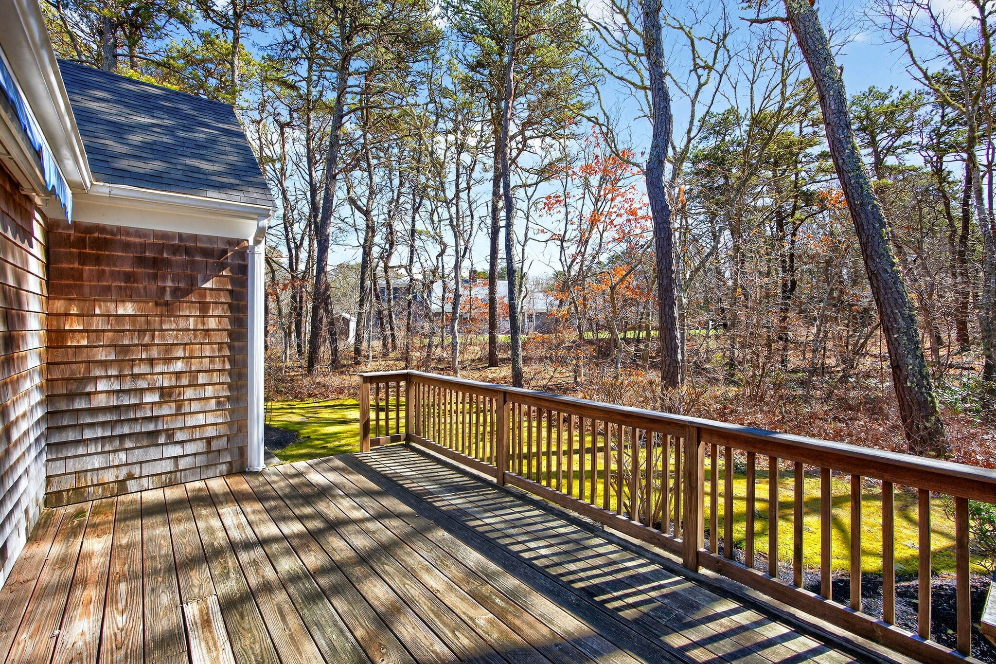 54 Marthas Lane Harwich, MA 02645 - Photo 48 of 53 a view of a balcony with wooden floor and fence