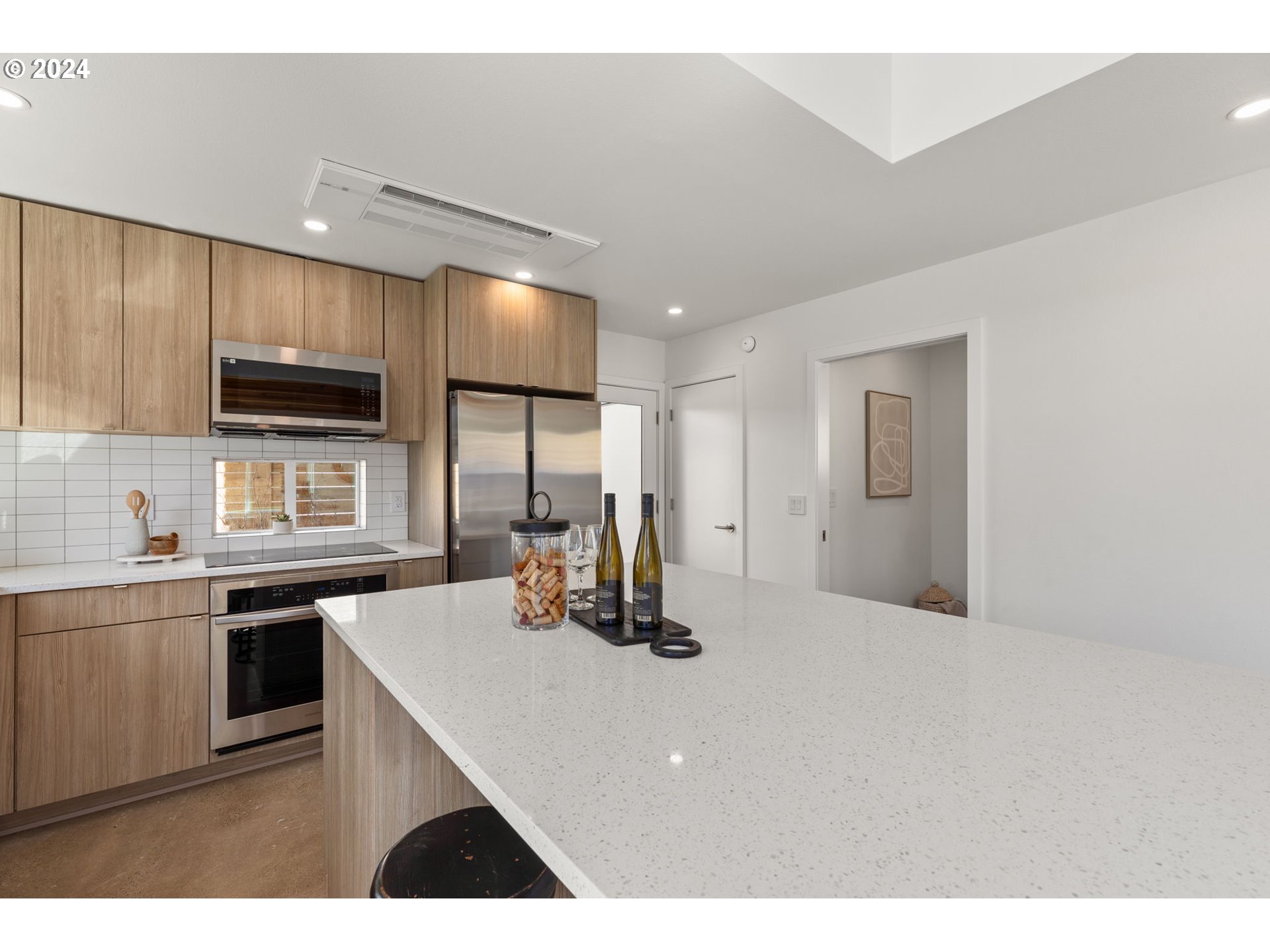 3590 Southwest Patton Road, Unit B Portland, OR 97221 - Photo 11 of 36 a kitchen with stainless steel appliances a sink stove and refrigerator