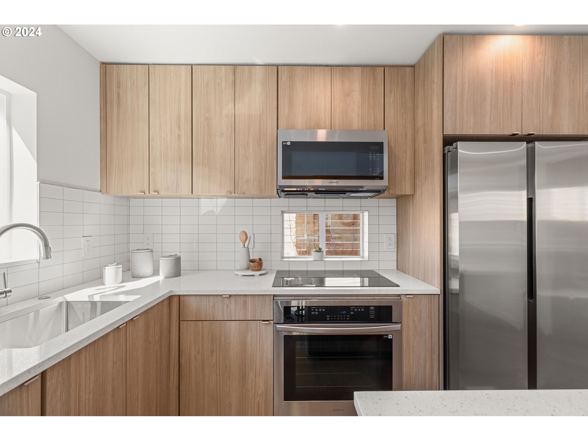 3590 Southwest Patton Road, Unit B Portland, OR 97221 - Photo 12 of 36 a kitchen with a sink stove and refrigerator