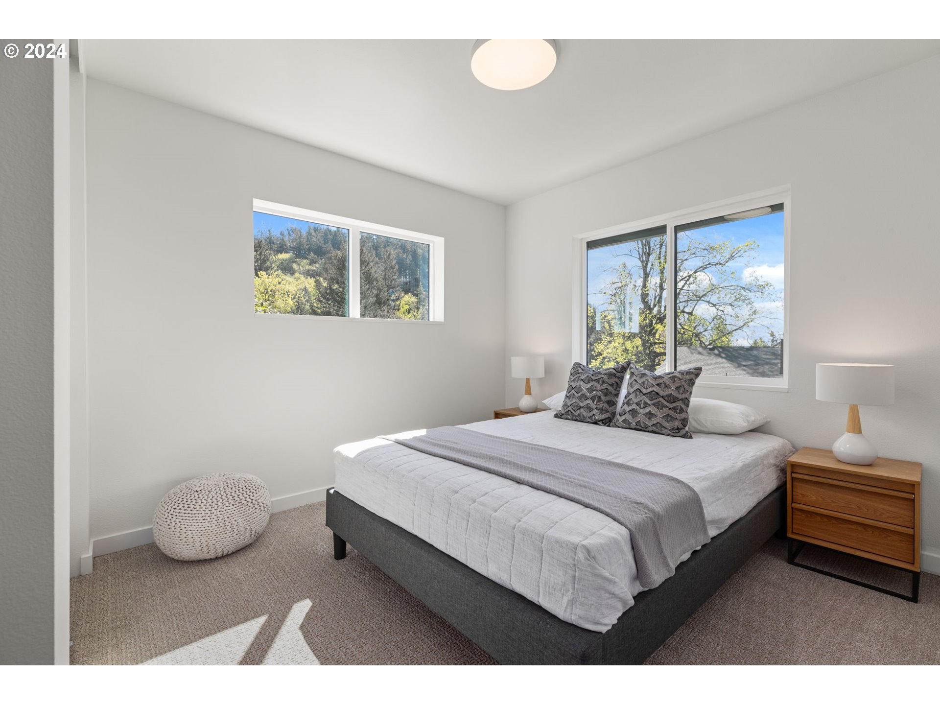 3590 Southwest Patton Road, Unit B Portland, OR 97221 - Photo 20 of 36 a bedroom with a bed and window