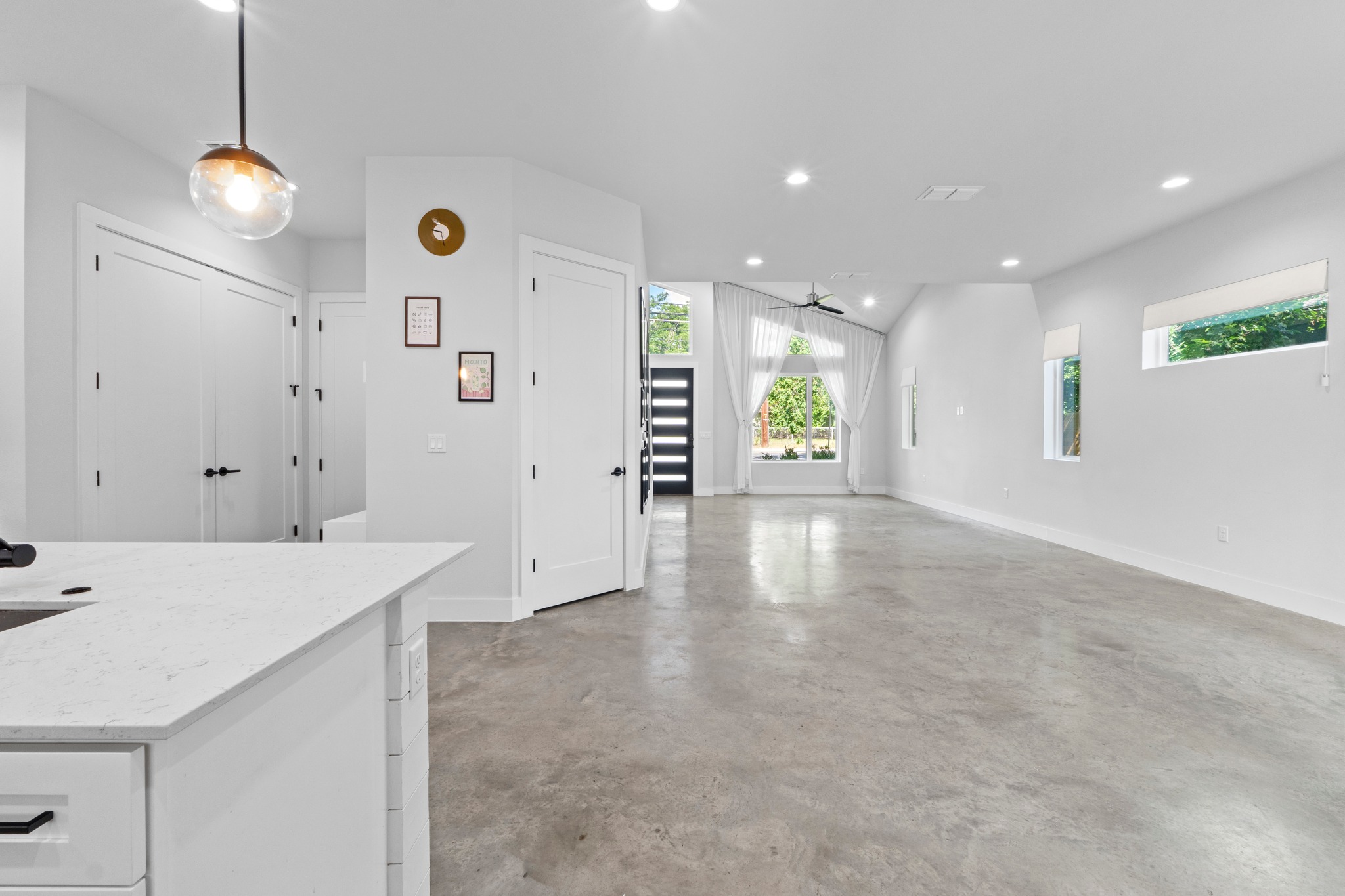 2007 Chestnut Avenue, Unit 1 Austin, TX 78722 - Photo 15 of 32 An open-concept living area with abundant natural light and a modern aesthetic.
