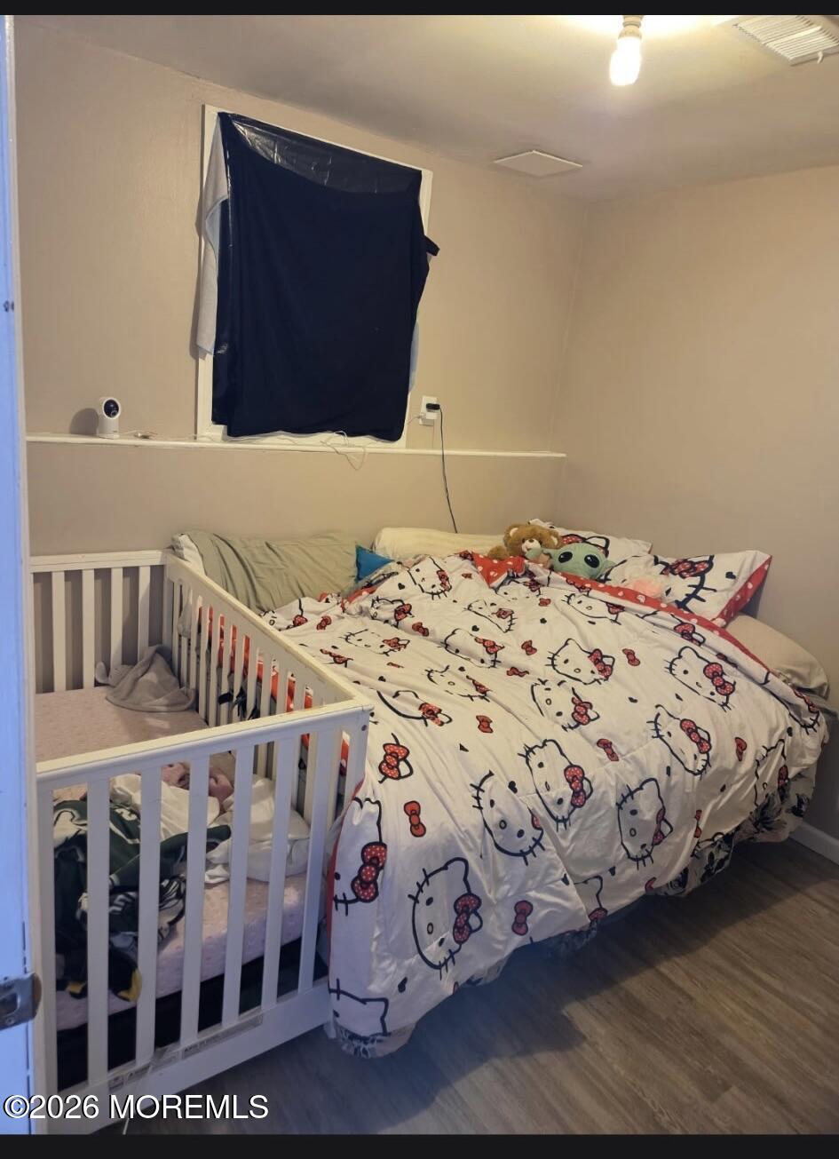 166 Sawmill Road, Unit 563 Brick, NJ 08724 - Photo 5 of 14 a bedroom with a bed and a window