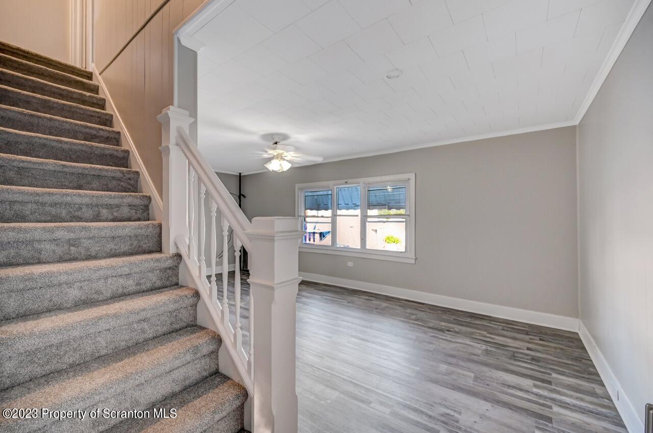 915 Ridge Avenue Scranton, PA 18510 - Photo 15 of 39 a view of entryway and hall with wooden floor