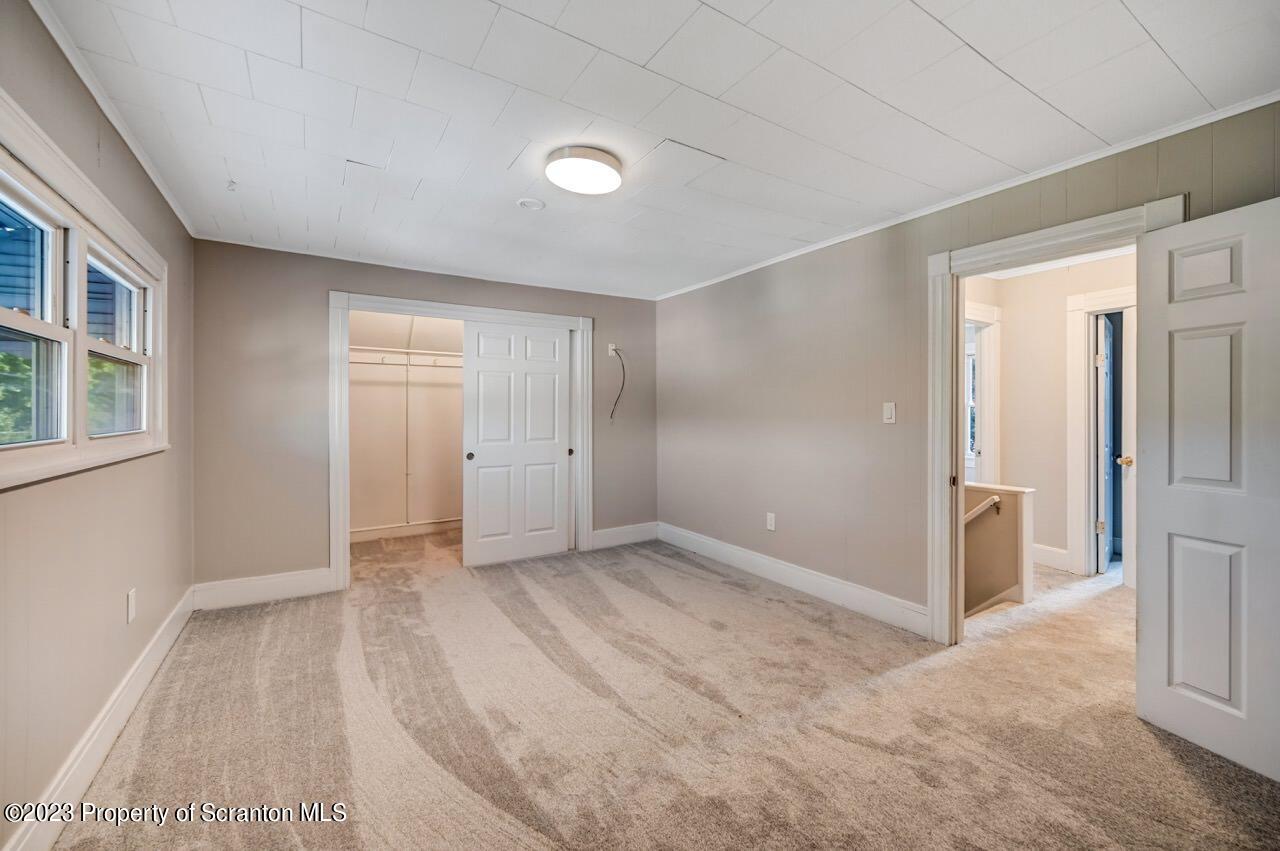 915 Ridge Avenue Scranton, PA 18510 - Photo 18 of 39 a view of an empty room with a fireplace