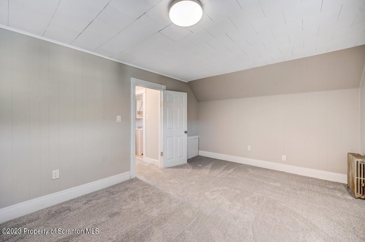 915 Ridge Avenue Scranton, PA 18510 - Photo 19 of 39 a view of an empty room with a window