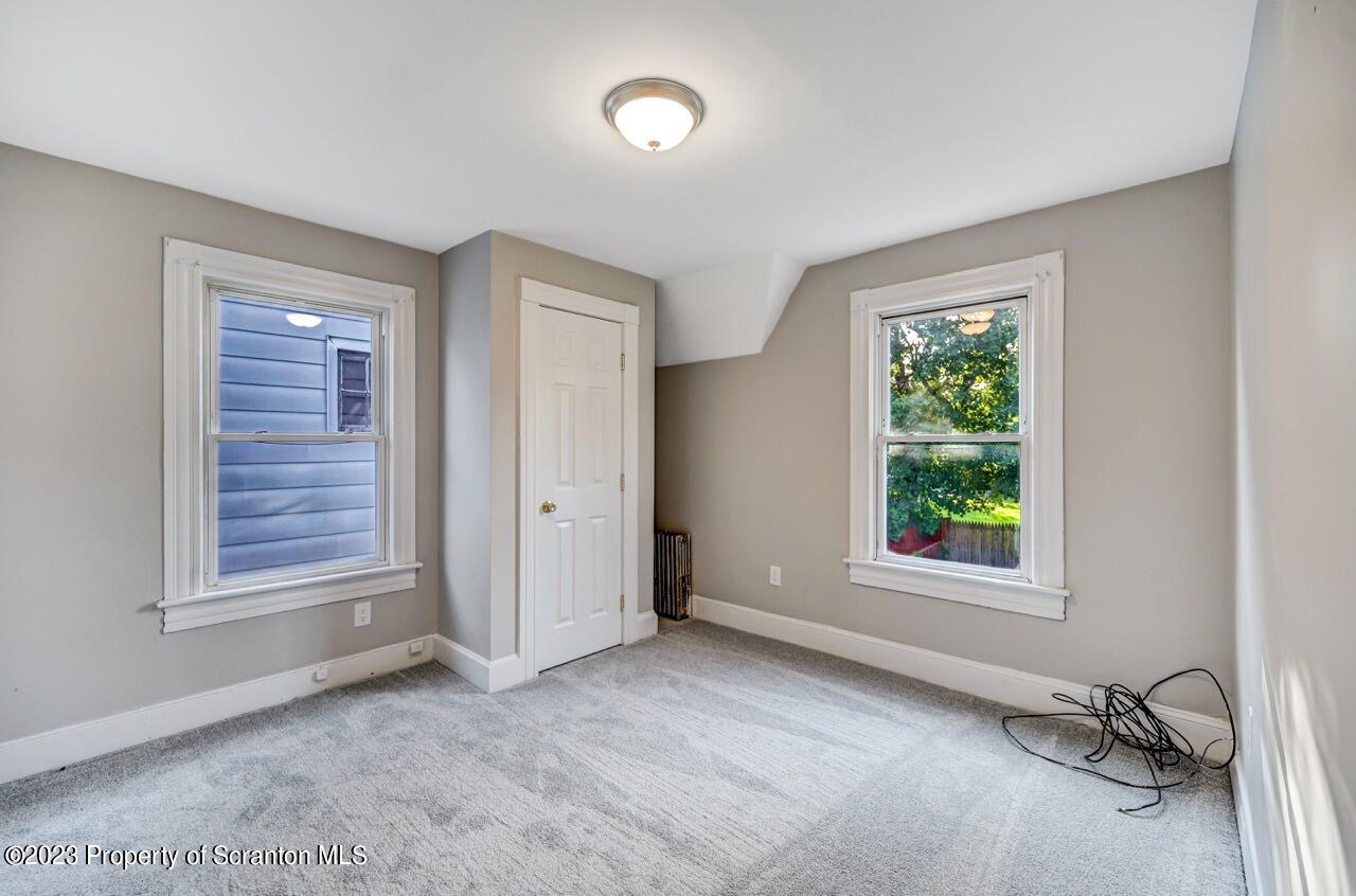 915 Ridge Avenue Scranton, PA 18510 - Photo 28 of 39 an empty room with windows and closet