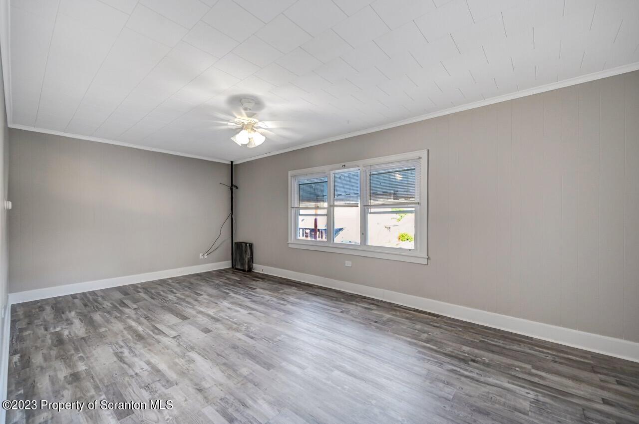 915 Ridge Avenue Scranton, PA 18510 - Photo 3 of 39 wooden floor in an empty room with a window