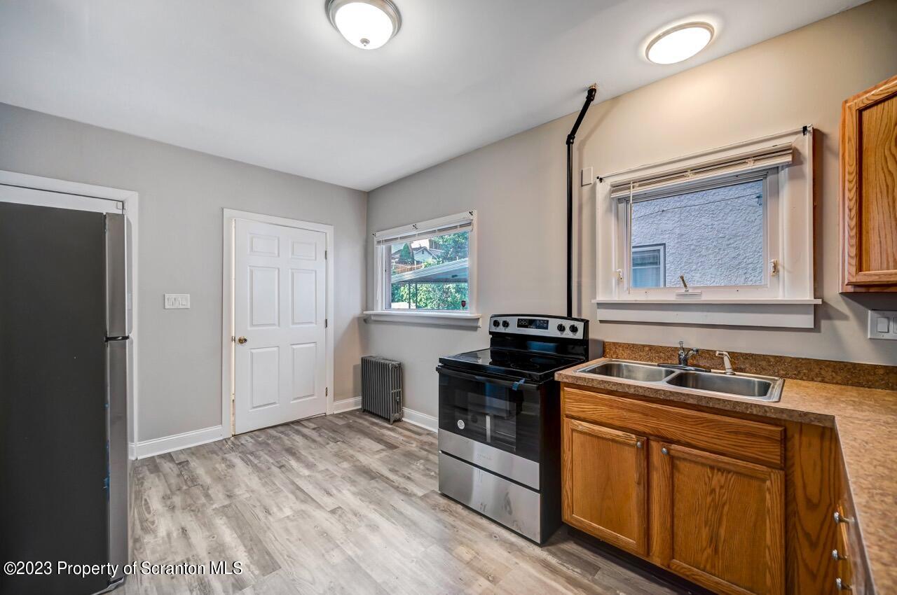 915 Ridge Avenue Scranton, PA 18510 - Photo 10 of 39 a kitchen that has a sink and a stove in it