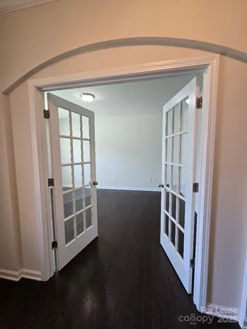 a view of front door with wooden floor