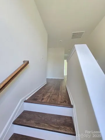 a view of a hallway with staircase