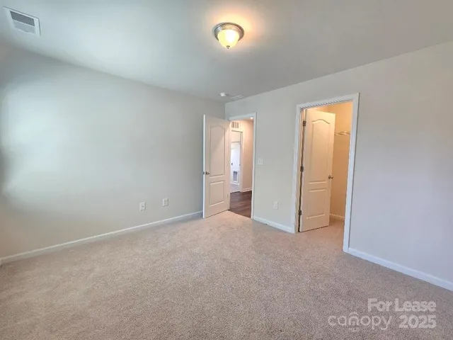 a spacious bathroom with a granite countertop sink a mirror and a