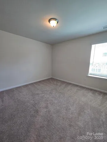a bathroom with a toilet and a bathtub
