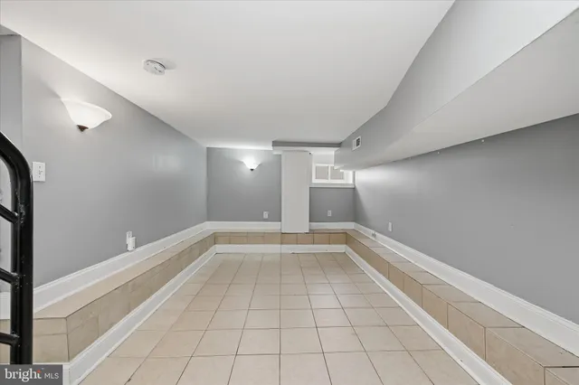 a view of an empty room and a window