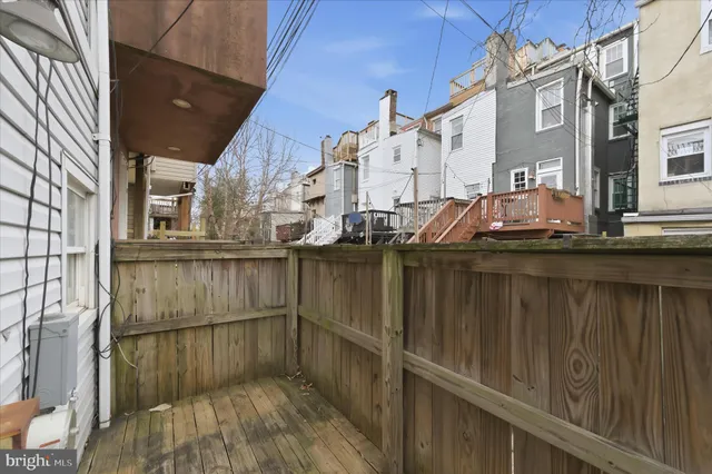 a view of a balcony with two chairs