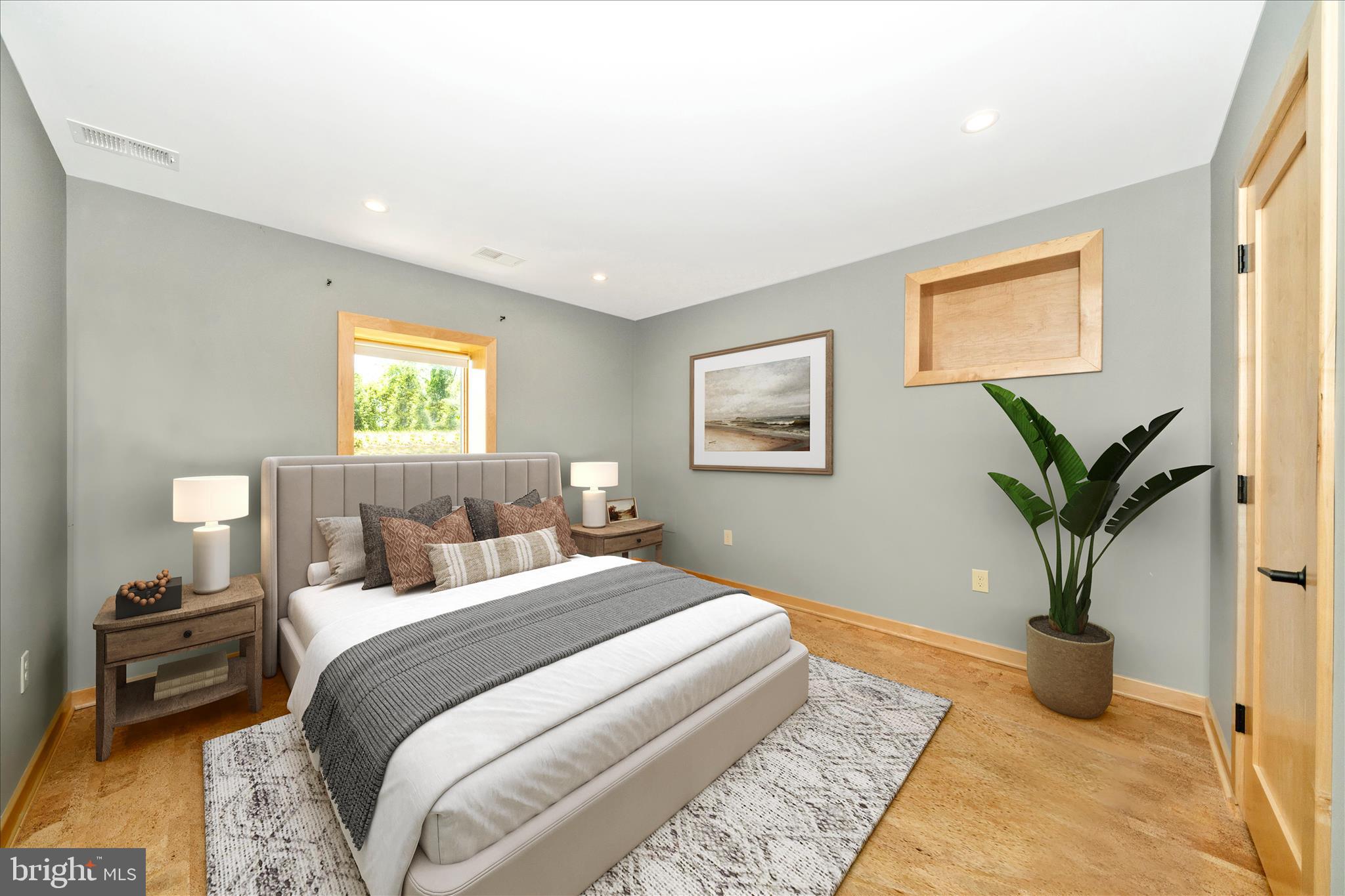 9237 Frostown Road Middletown, MD 21769 - Photo 61 of 113 a bedroom with a large bed and a potted plant