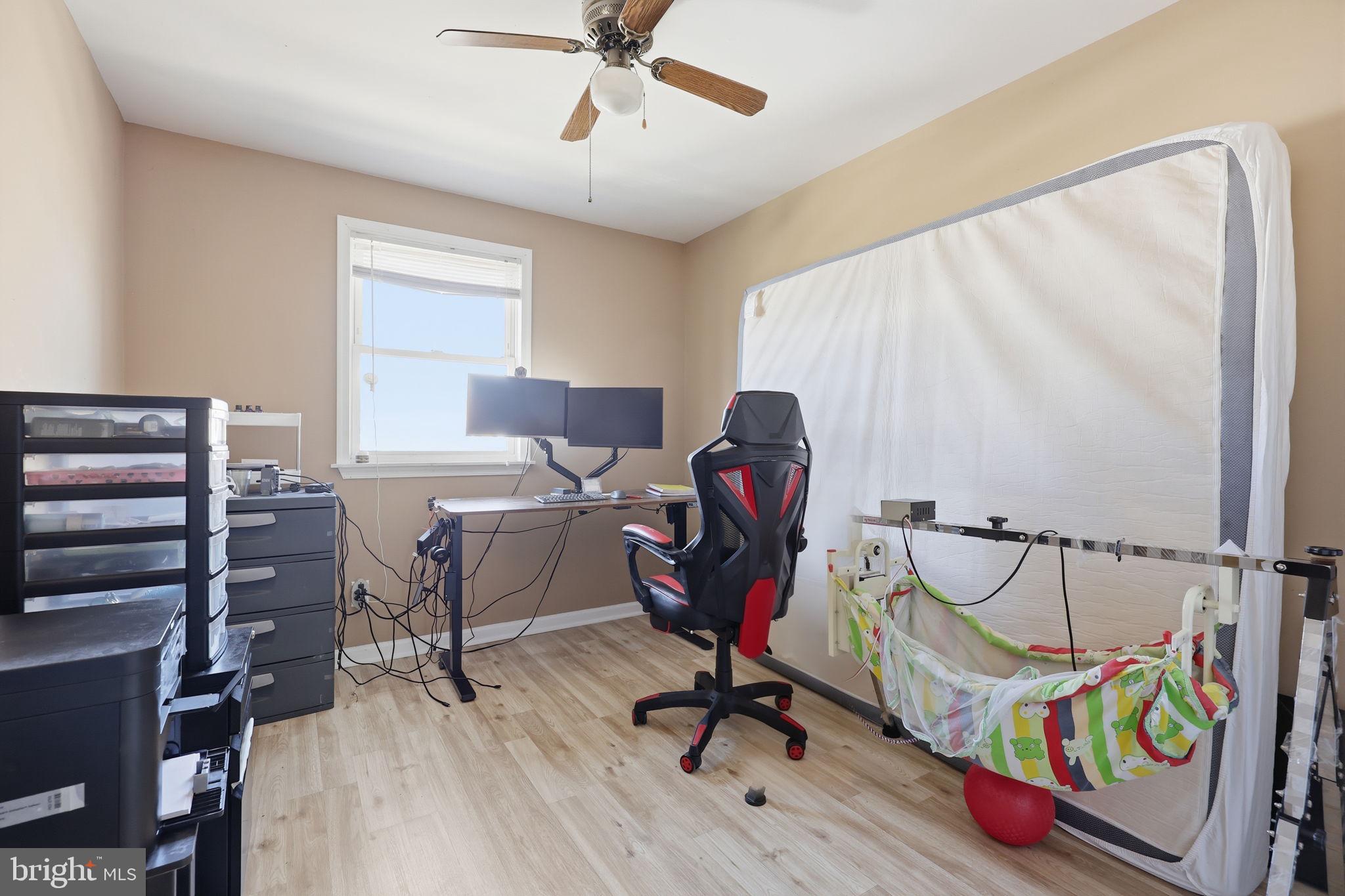 5203 Bay Road, Unit N Bensalem, PA 19020 - Photo 15 of 27 a view of a workspace with furniture and a window