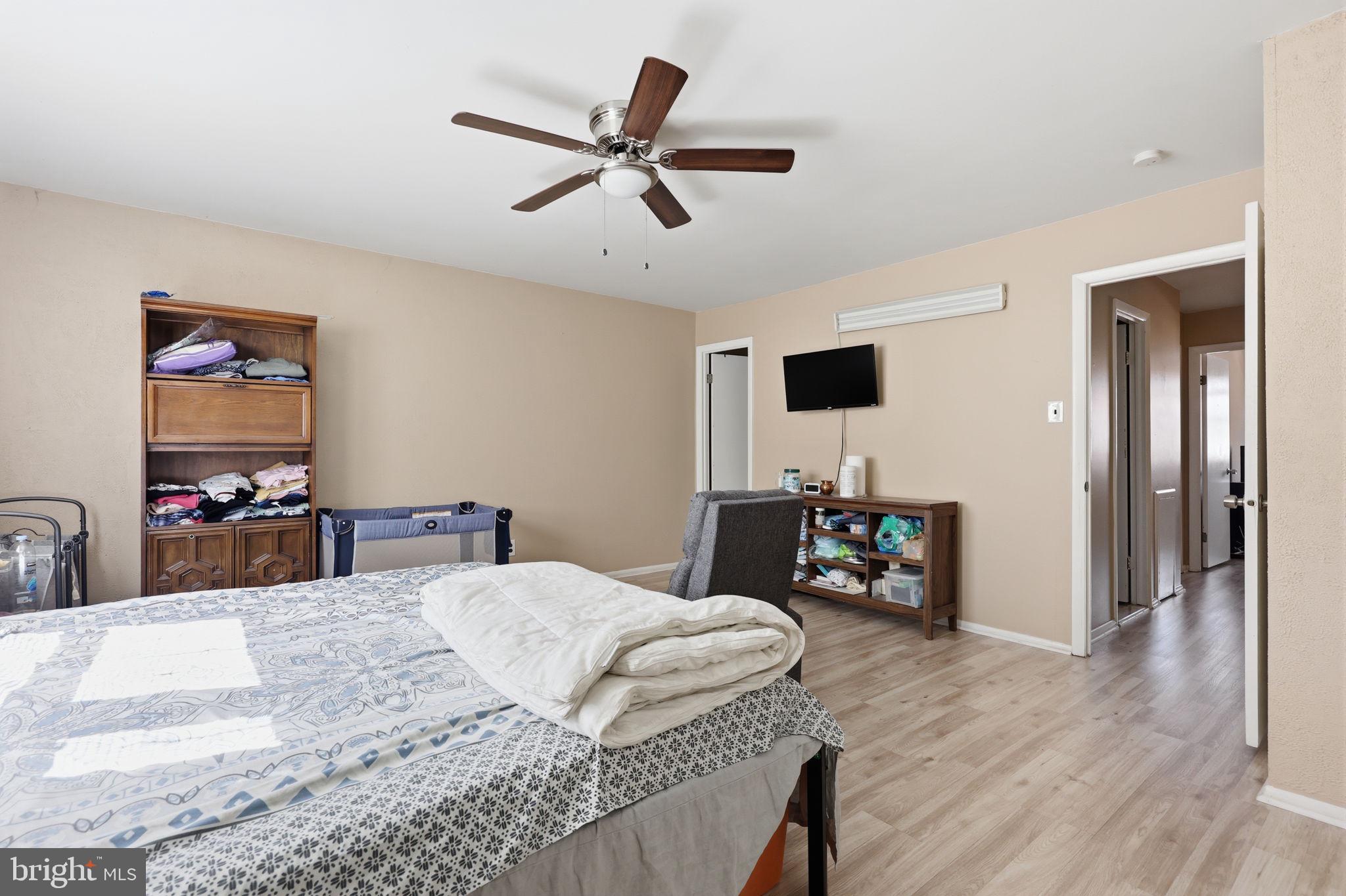 5203 Bay Road, Unit N Bensalem, PA 19020 - Photo 20 of 27 a bedroom with a bed and a flat screen tv
