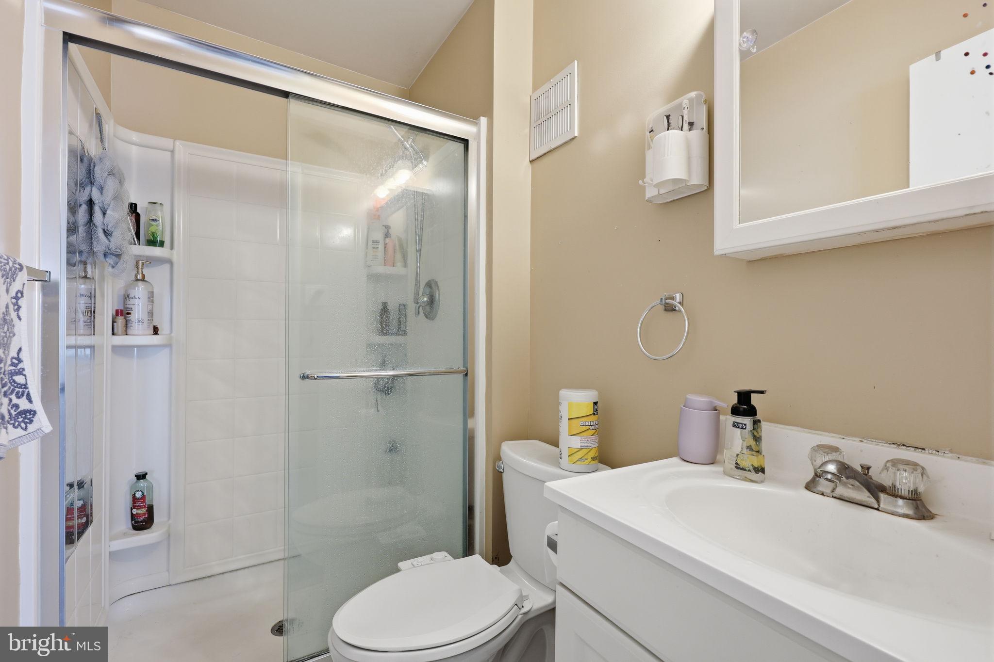 5203 Bay Road, Unit N Bensalem, PA 19020 - Photo 22 of 27 a bathroom with a sink toilet and shower