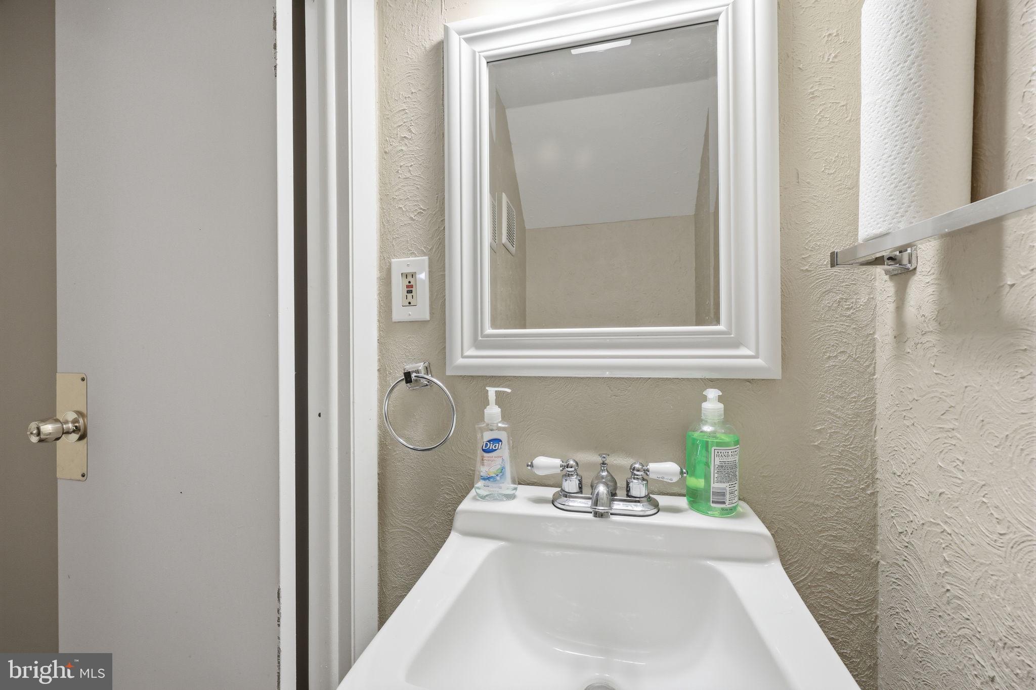 5203 Bay Road, Unit N Bensalem, PA 19020 - Photo 24 of 27 a bathroom with a sink and a mirror