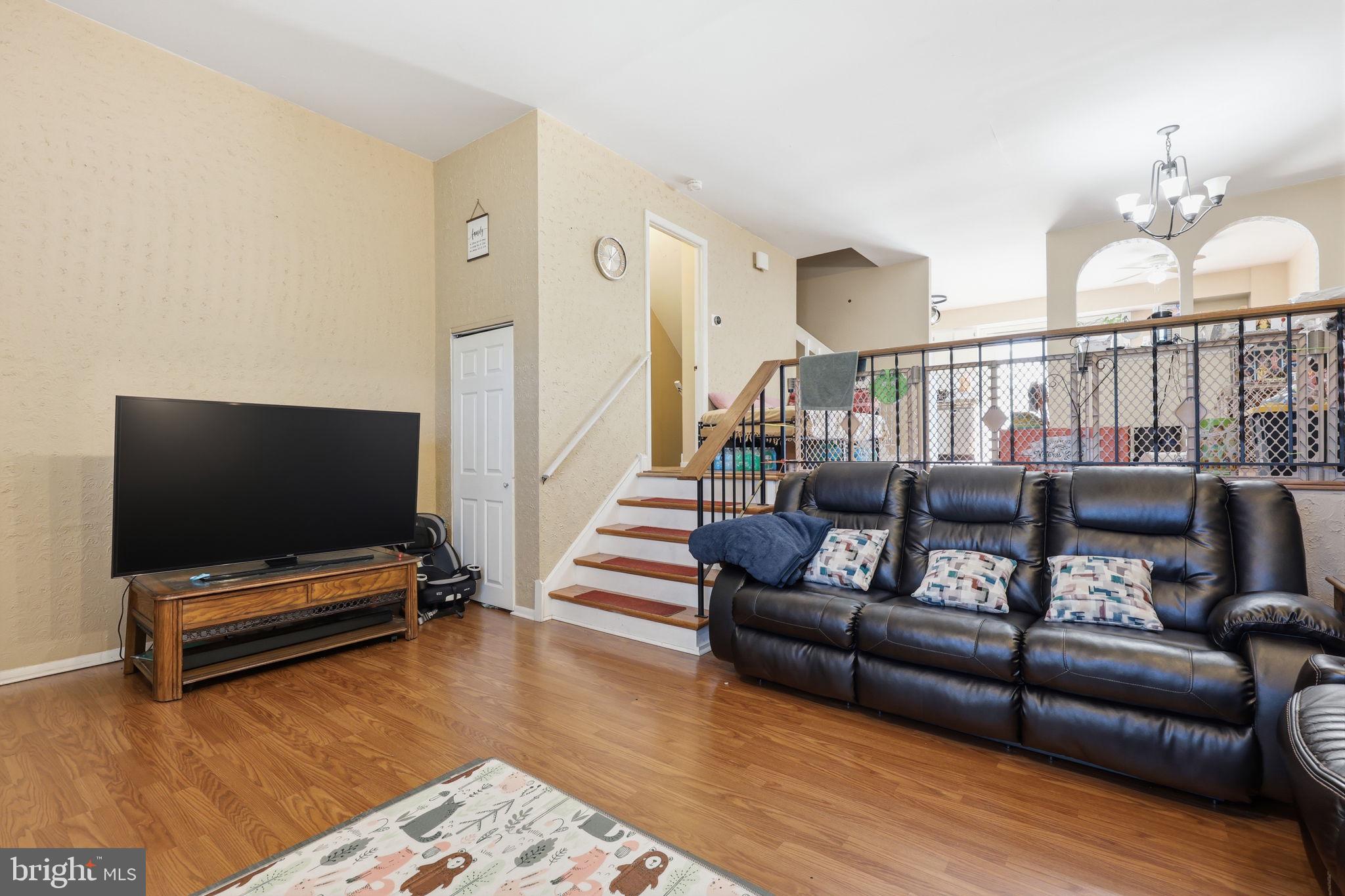 5203 Bay Road, Unit N Bensalem, PA 19020 - Photo 5 of 27 a living room with furniture and wooden floor