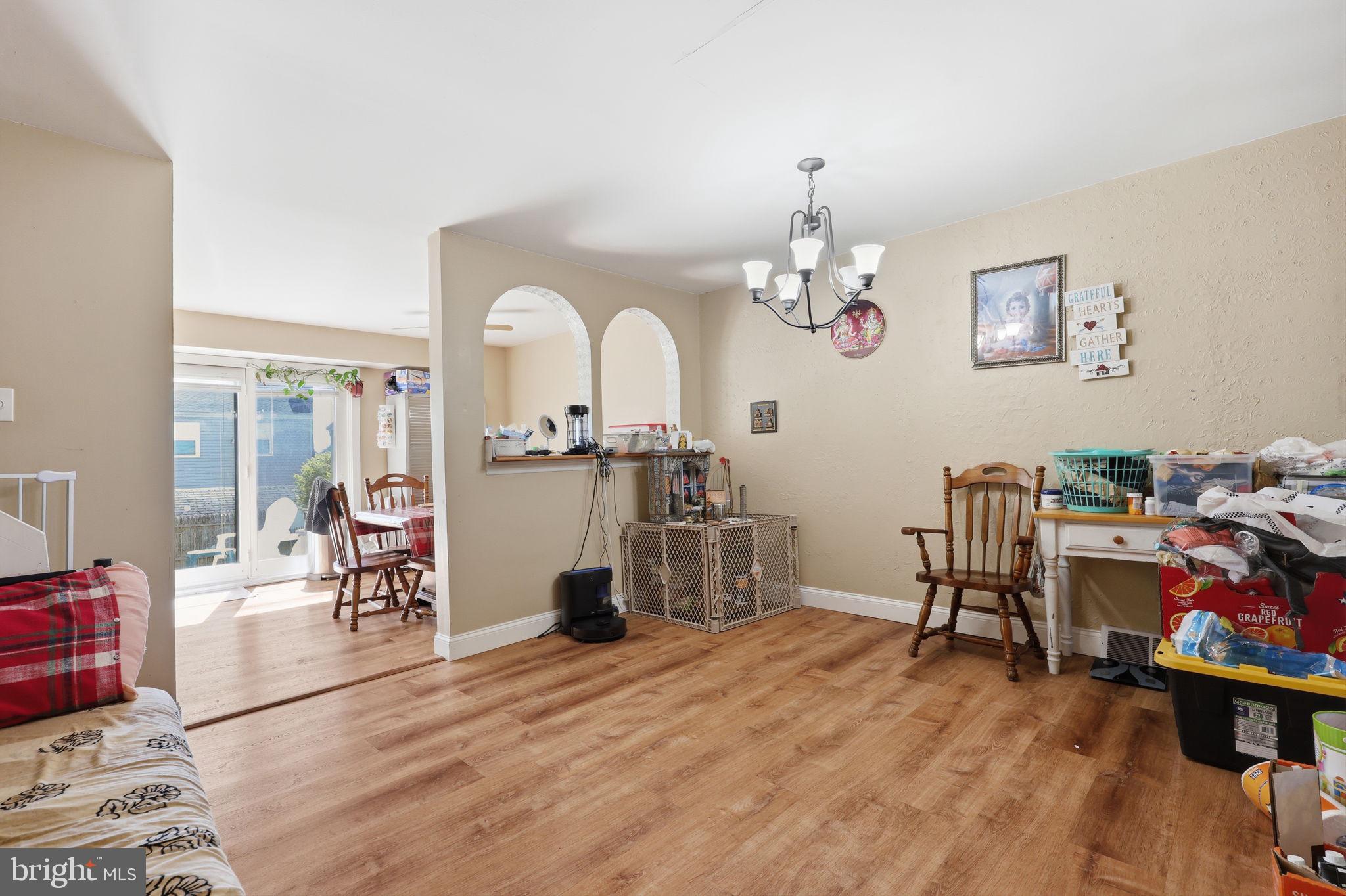 5203 Bay Road, Unit N Bensalem, PA 19020 - Photo 7 of 27 a view of a dining room with furniture and wooden floor