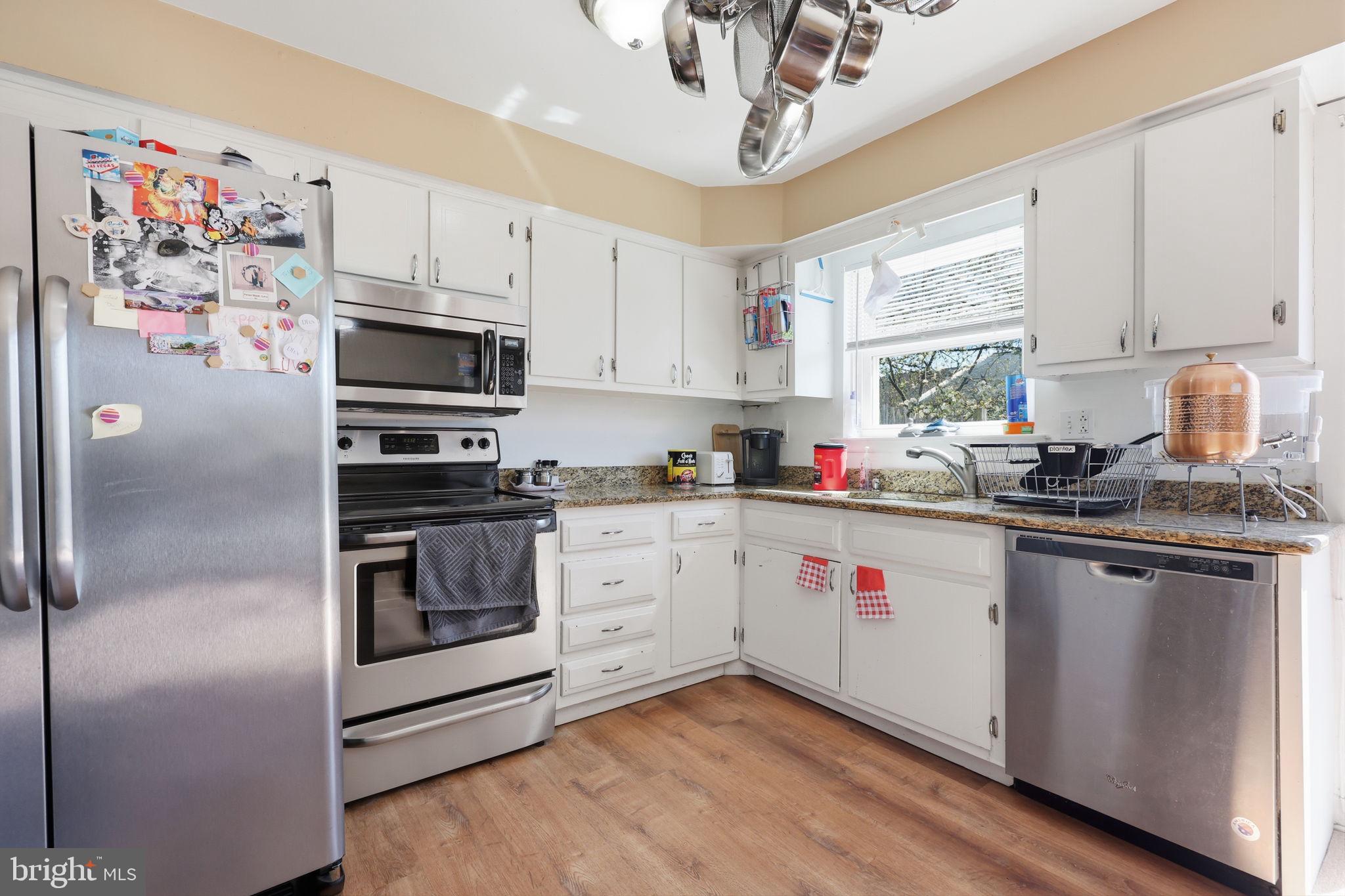 5203 Bay Road, Unit N Bensalem, PA 19020 - Photo 10 of 27 a kitchen with a refrigerator and white cabinets
