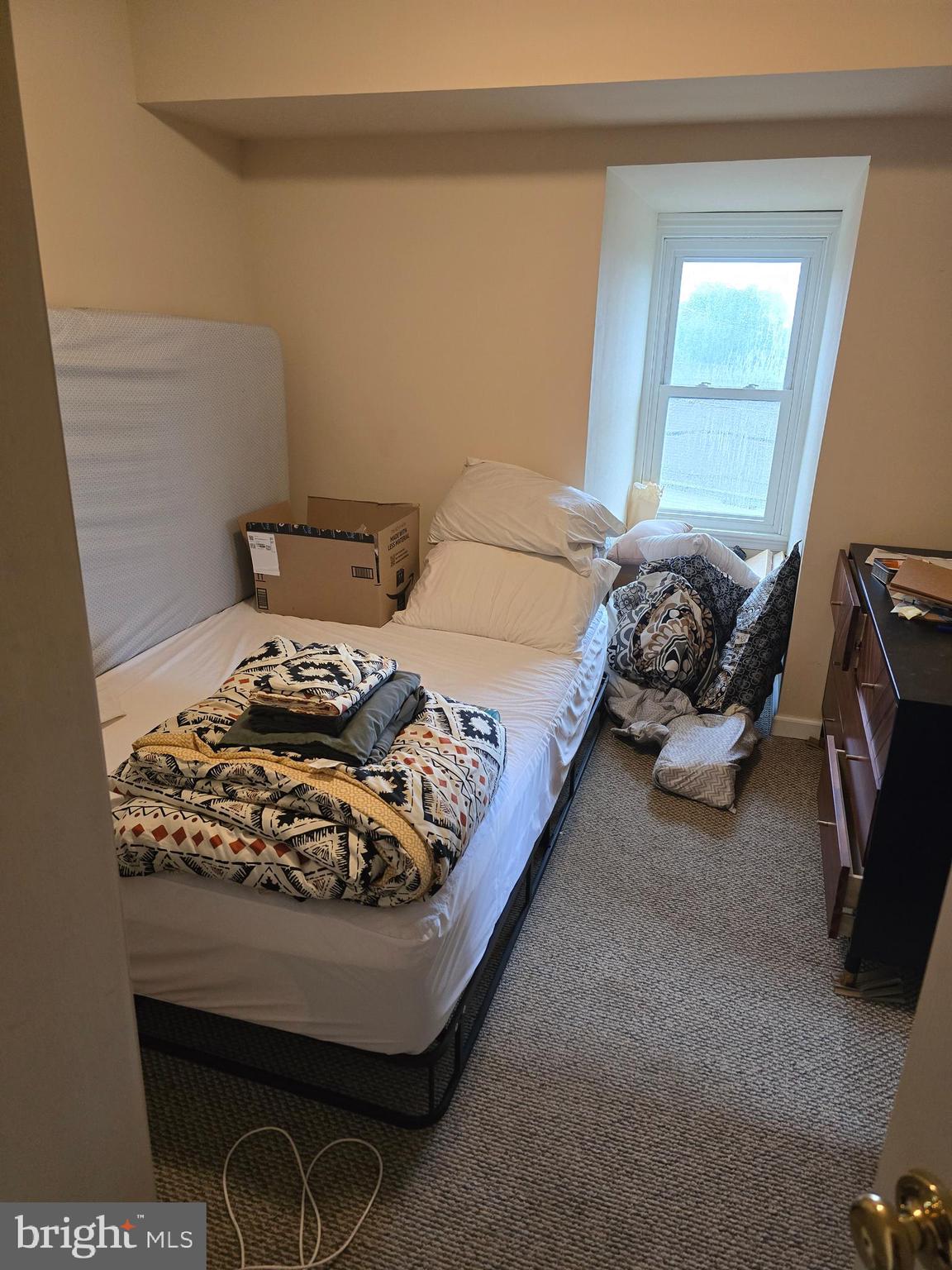 4894 Old Easton Road Doylestown, PA 18902 - Photo 19 of 19 a bed sitting in a bedroom next to a window