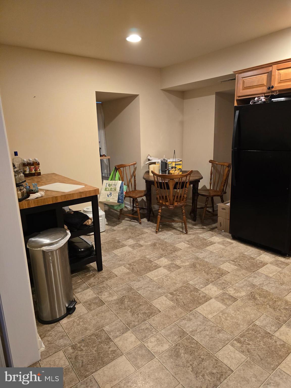 4894 Old Easton Road Doylestown, PA 18902 - Photo 9 of 19 a room with a table chairs and a refrigerator