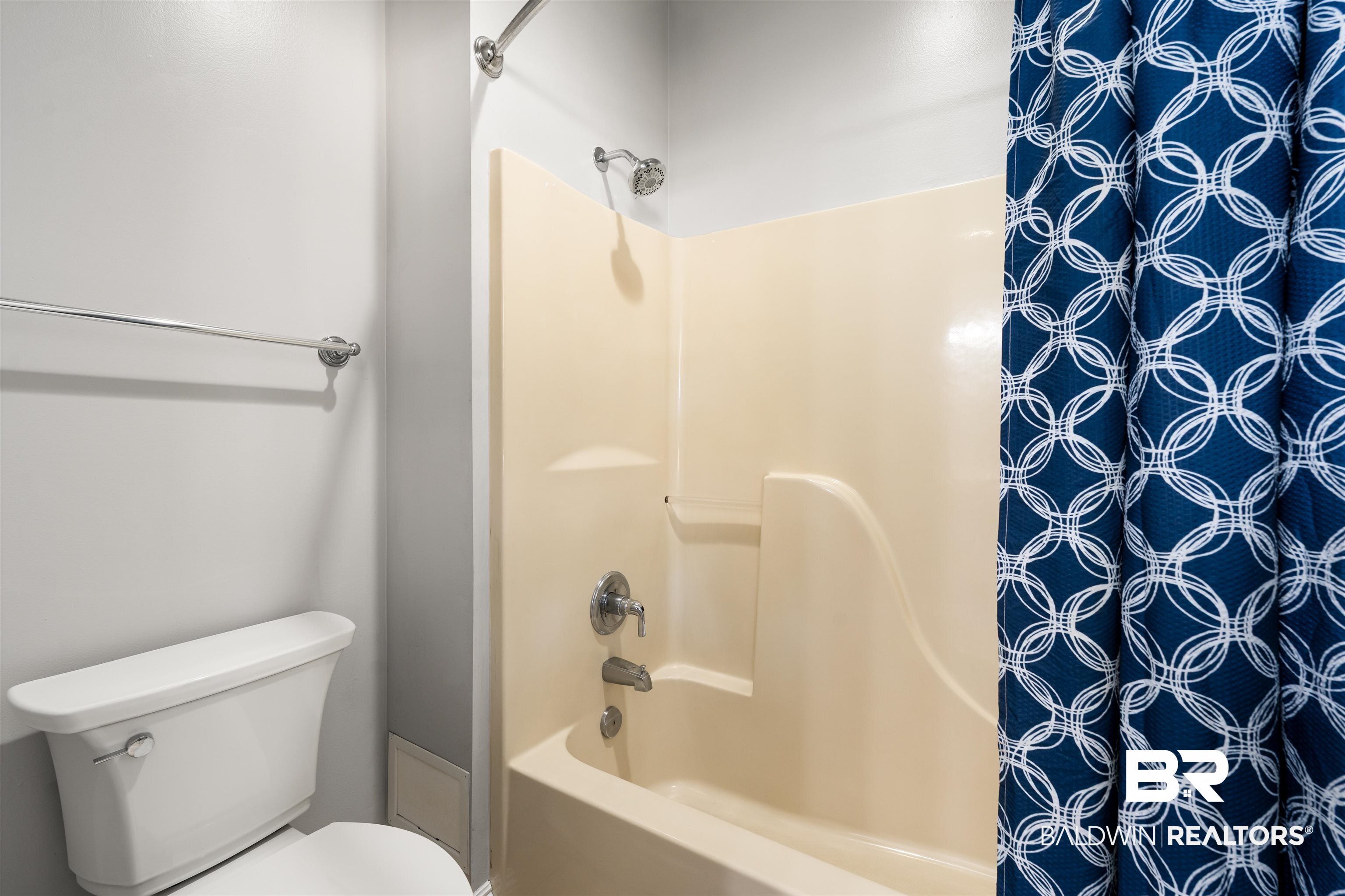 19079 Baldwin County Road 10 Foley, AL 36535 - Photo 17 of 37 Full bathroom featuring shower / bath combination with curtain and toilet