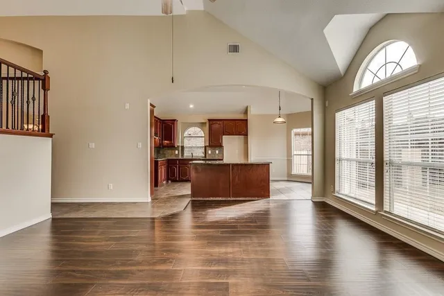 a view of kitchen with cabinets and wooden floor