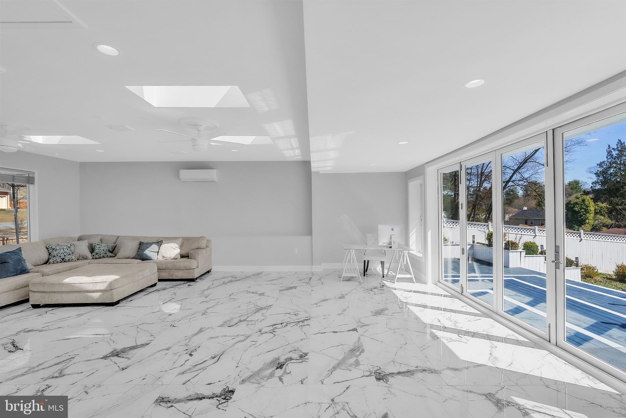 14933 Wellwood Road Silver Spring, MD 20905 - Photo 19 of 50 Large family room with indoor-outdoor living.