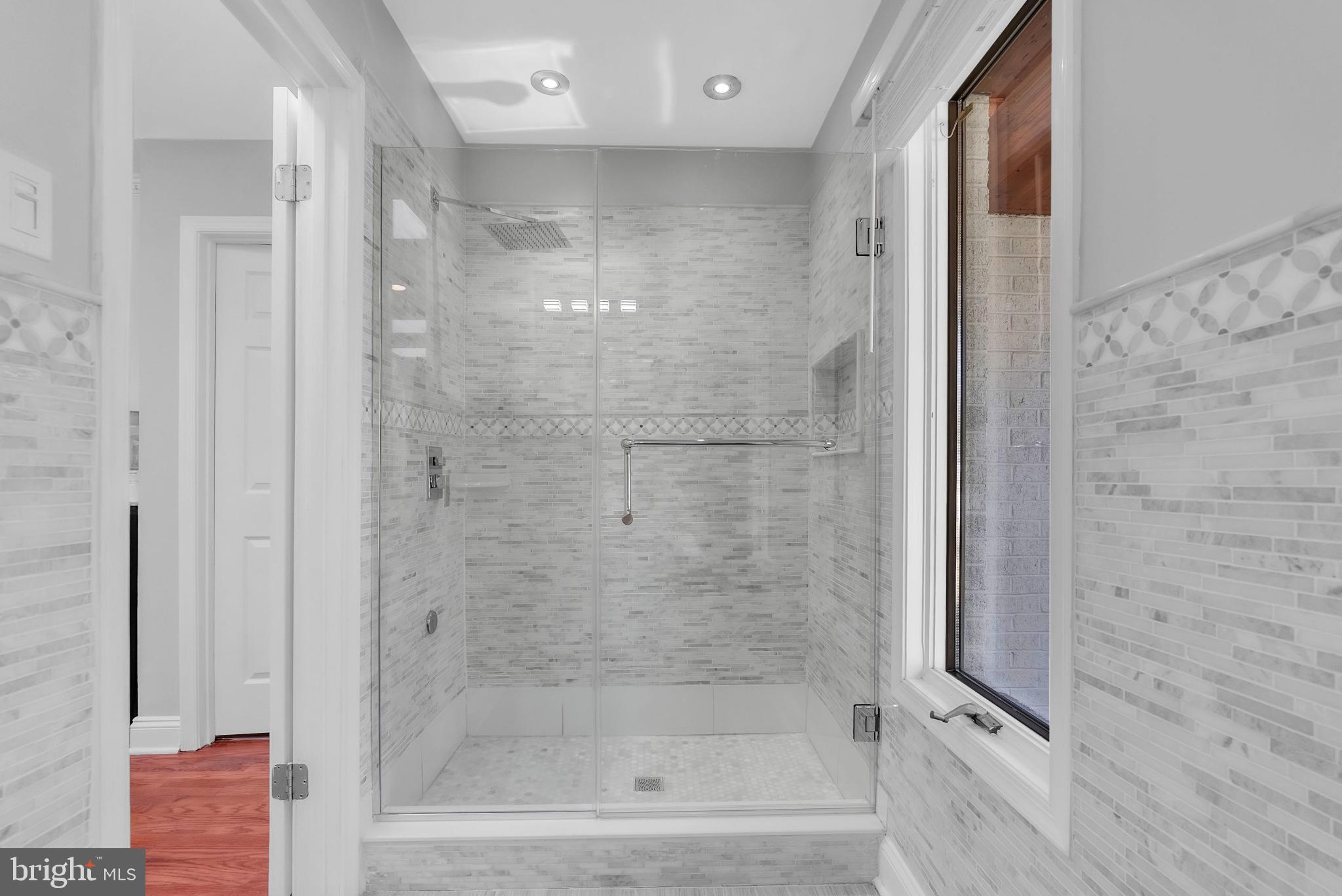 14933 Wellwood Road Silver Spring, MD 20905 - Photo 24 of 50 Sleek modern shower with elegant tile design