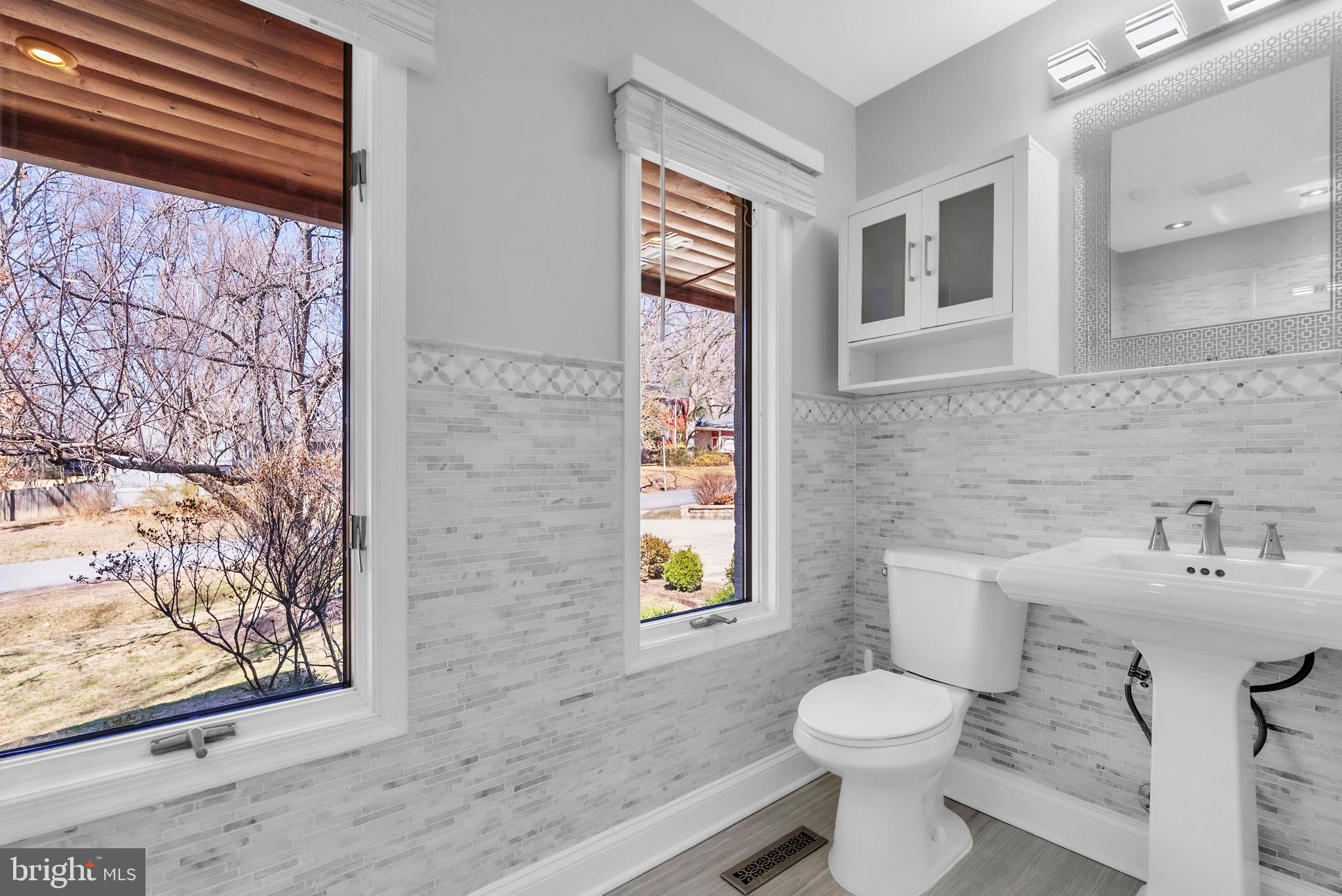 14933 Wellwood Road Silver Spring, MD 20905 - Photo 25 of 50 Bright and airy full bathroom on main level.