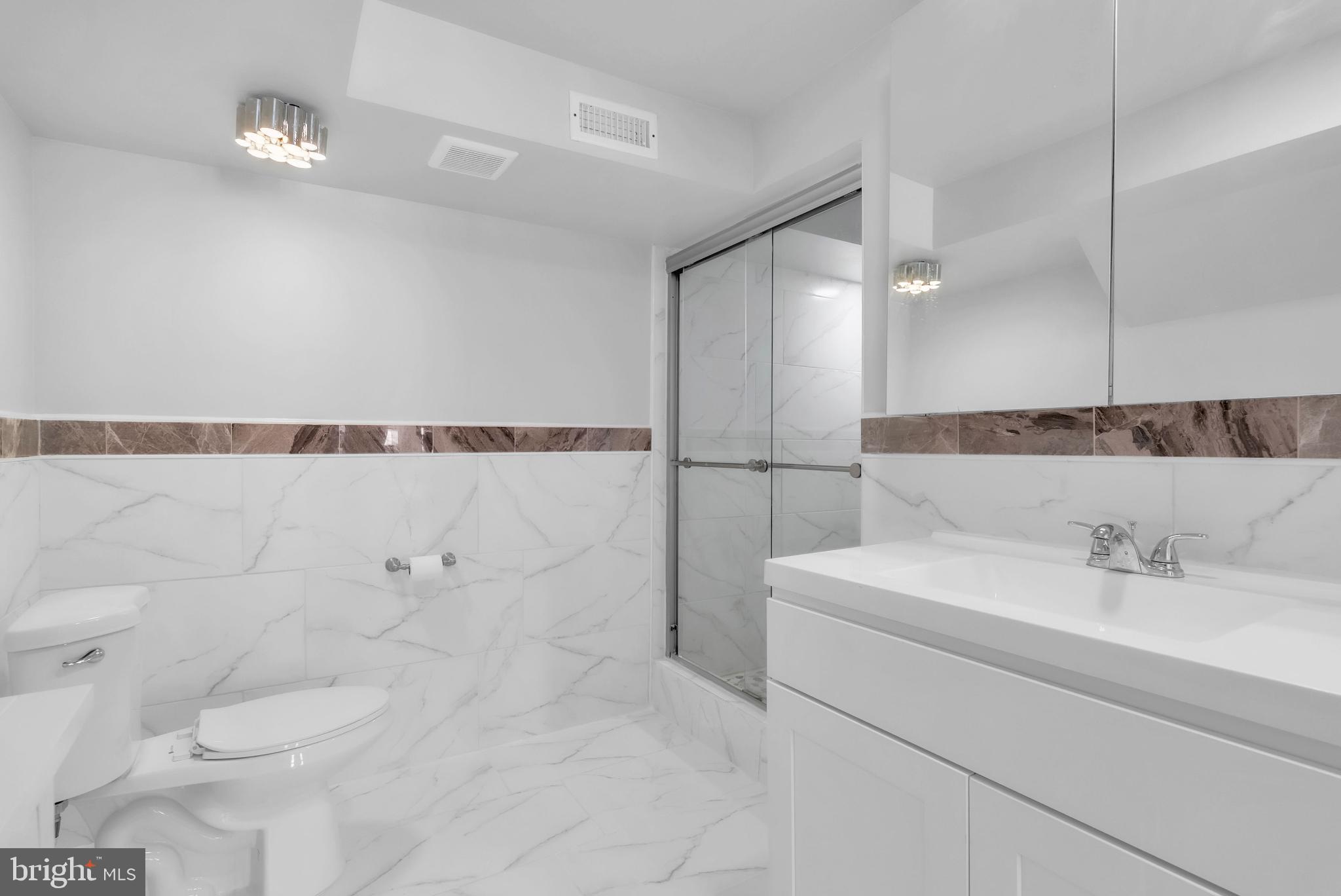 14933 Wellwood Road Silver Spring, MD 20905 - Photo 29 of 50 Sleek modern ensuite bathroom.