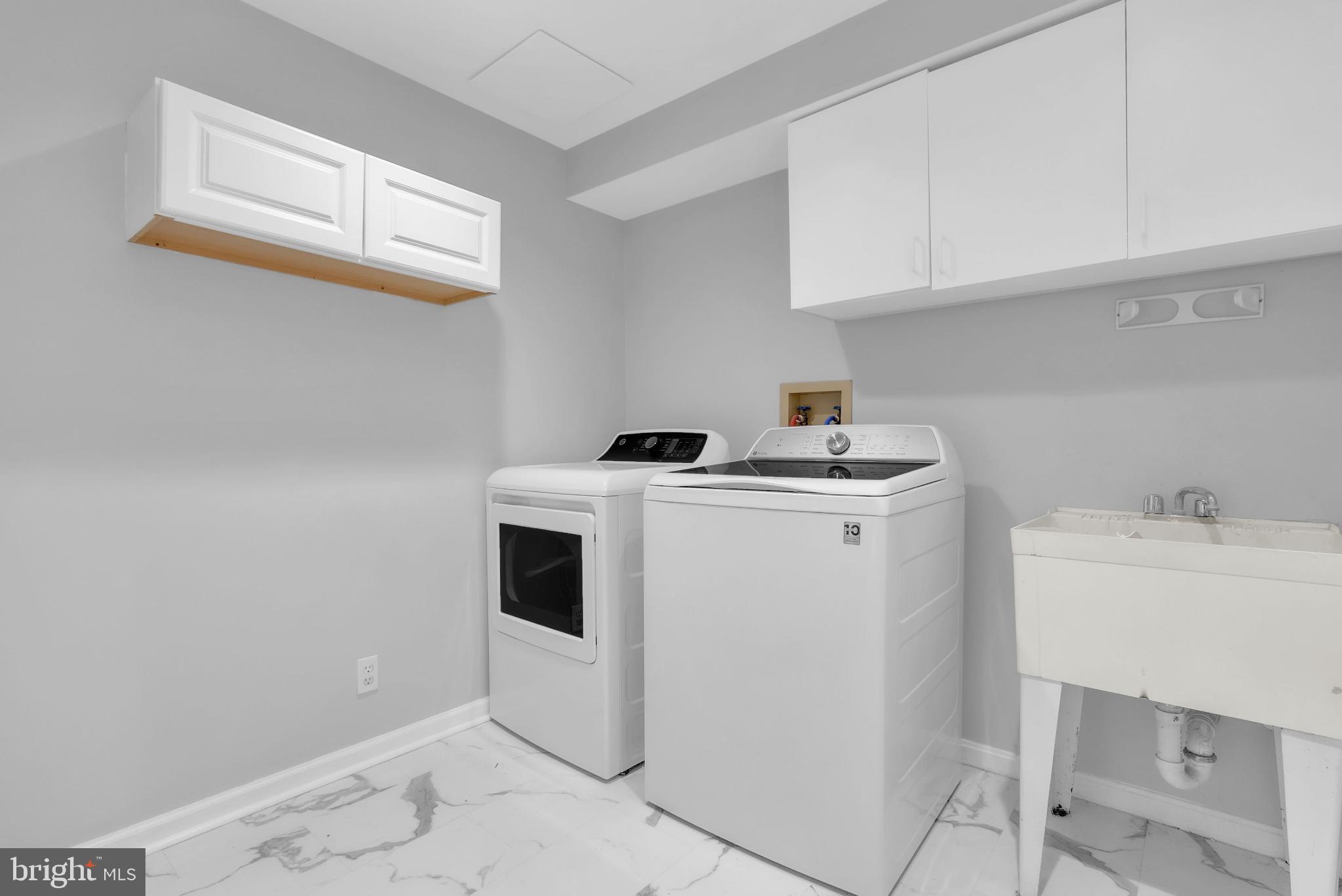 14933 Wellwood Road Silver Spring, MD 20905 - Photo 31 of 50 Sleek laundry room area on bedroom level.